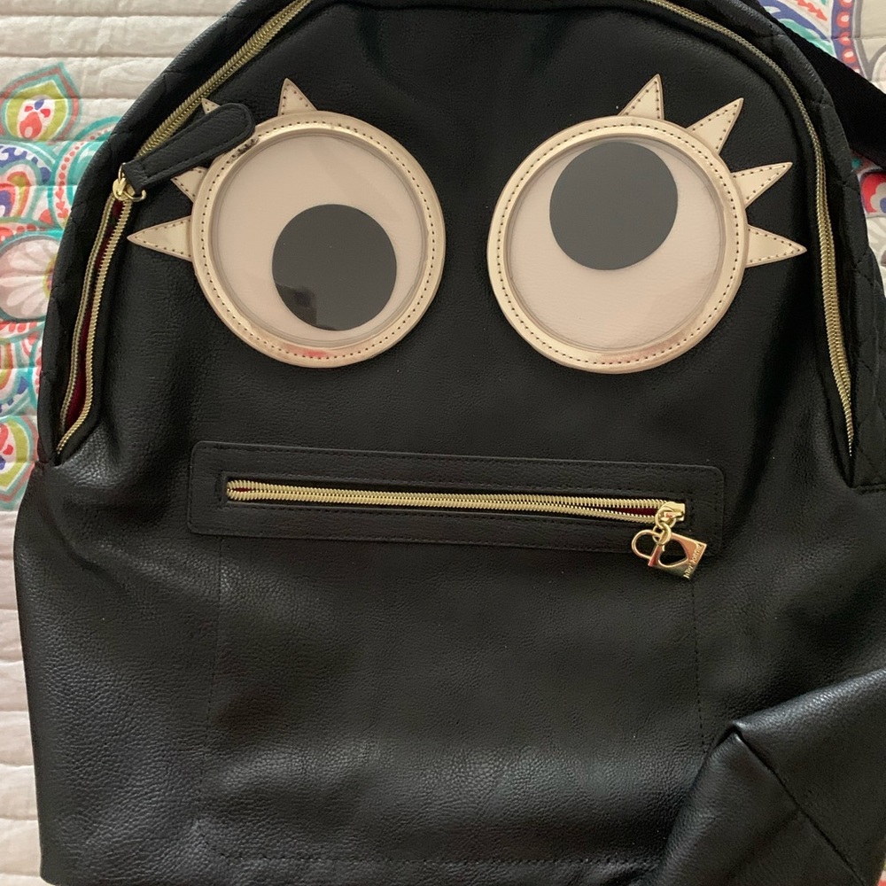 Betsy Johnson faux leather small backpack.